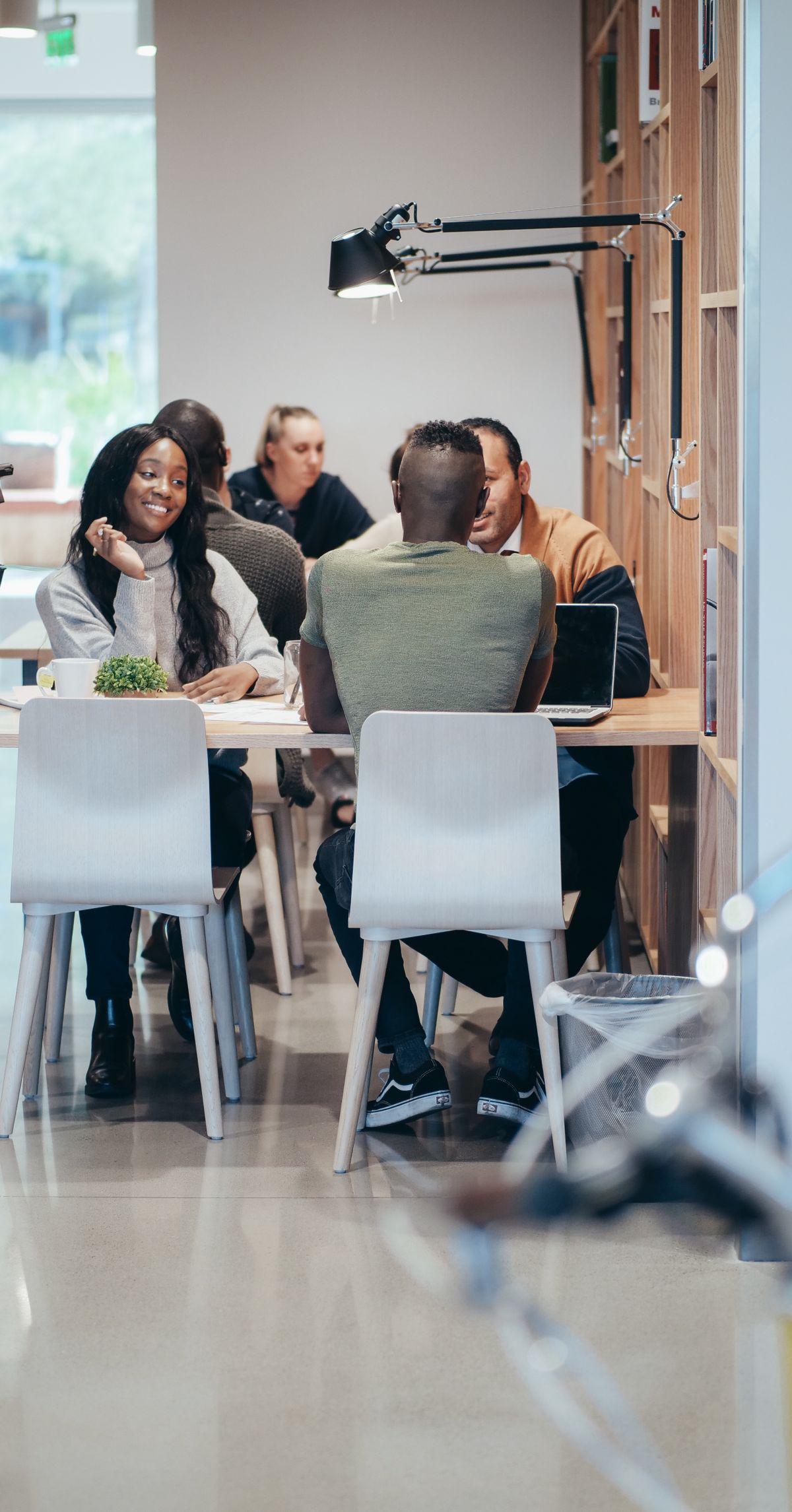 Coworkers gathered around a table for a meeting